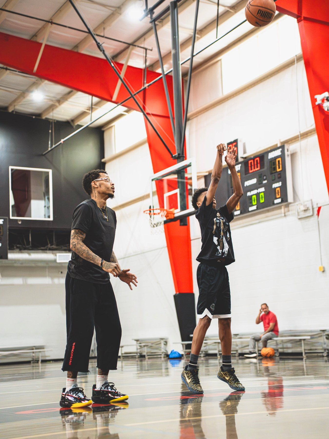 Cooper Head goes up for a shot during a training session in the gym with trainer Jordan Coleman.