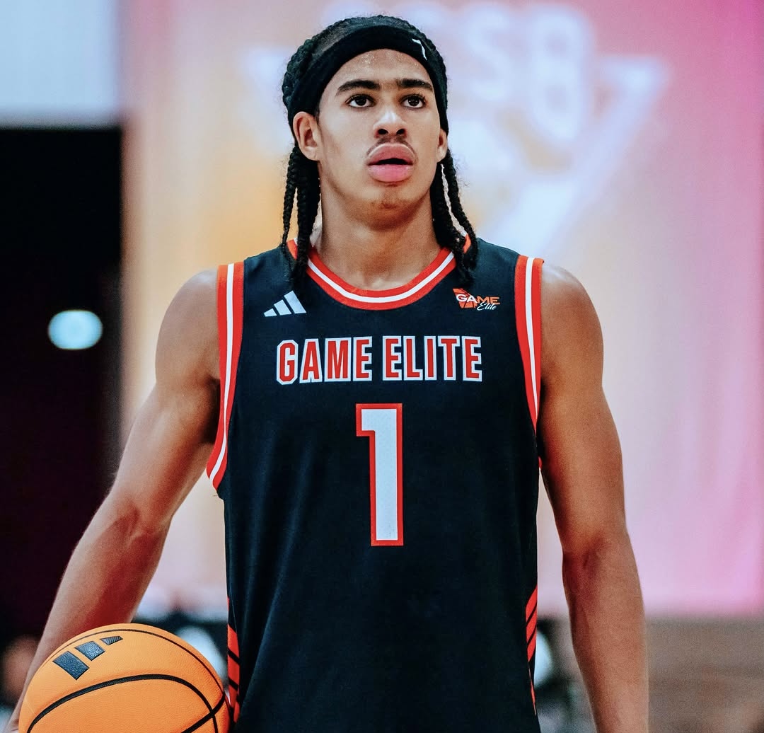 Purdue commit Kevin Savage III of Game Elite dribbles up the court during an adidas 3SSB matchup with Team Loaded Virginia, wearing the black Game Elite No. 1 jersey.
